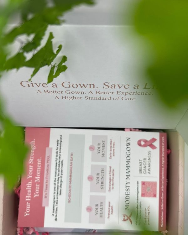 MammoGown gift box with reminder card, promoting breast cancer awareness.