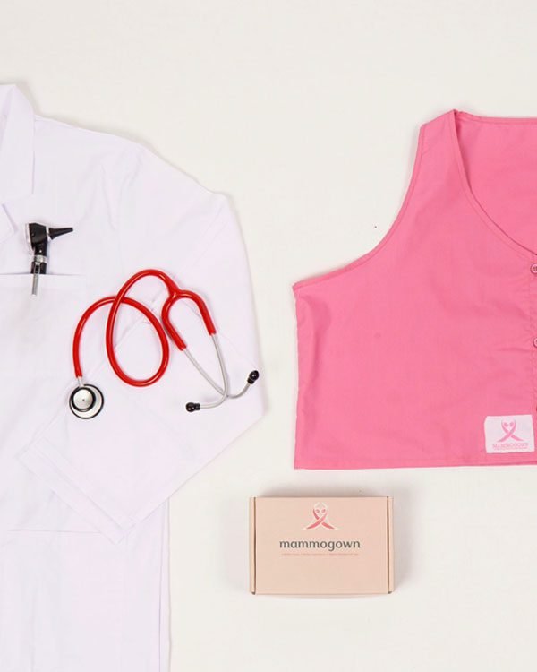Medical-themed flat lay with MammoGown, stethoscope, and gift box.